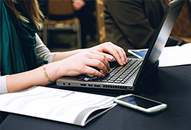 Lady typing on laptop